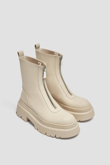 Flat ankle boots with zip detail.