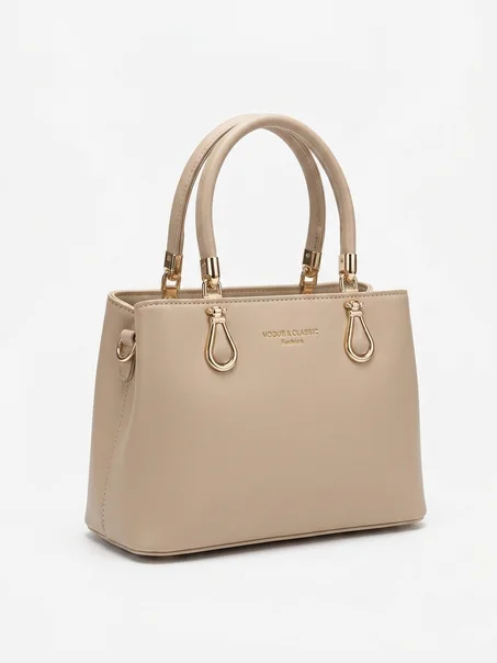 حقيبة يد نسائية متوسطة الحجم (Top-handle satchel)، تتميز بتصميم كلاسيكي ومنظم (Structured) يجمع بين الأناقة والعملية. (copy) (copy)