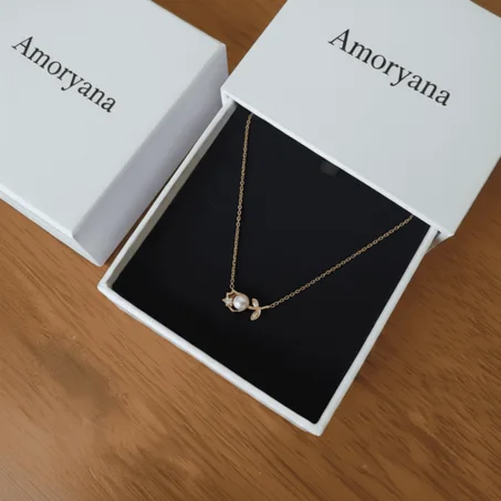 A gold rose-shaped necklace