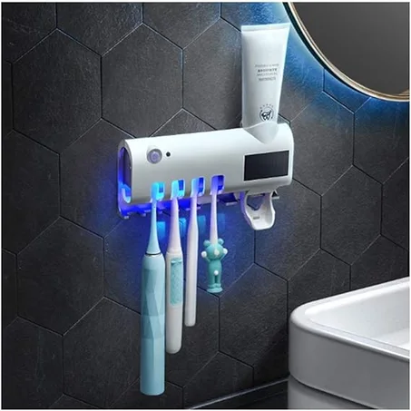 Stérilisateur de brosse à dents UV avec support et distributeur automatique de dentifrice.
