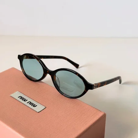 Lunettes de soleil Miaw Miaw motif léopard avec verres bleus