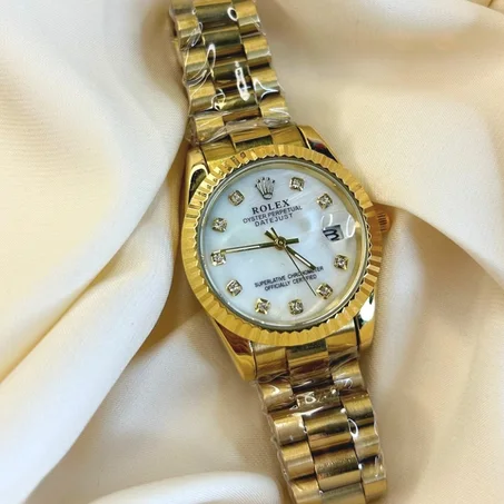 Montre Rolex or avec cadran blanc