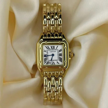 Montre Cartier dorée