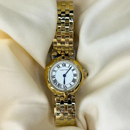 Montre Cartier dorée