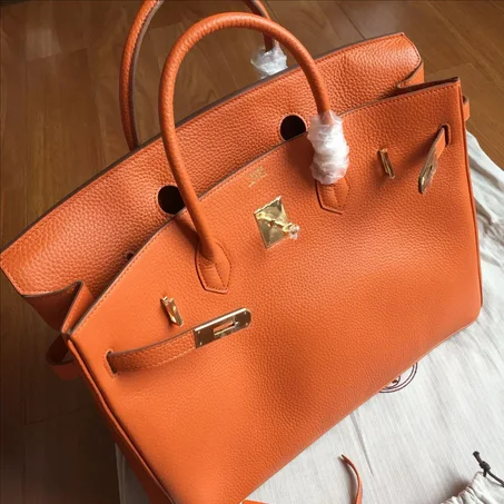 Sac à main Hermès Birkin 25 cm en cuir Swift rose Thé