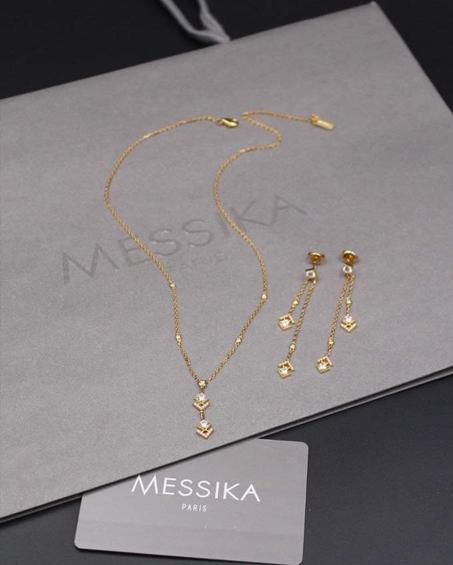 Messika gold necklace + earrings