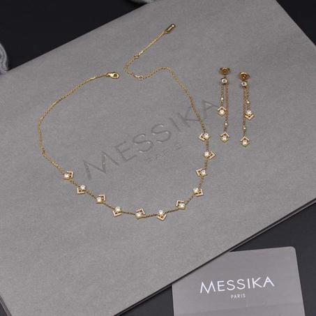 Messika gold necklace + earrings
