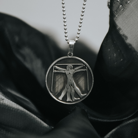 SILVER TONED LEONARDO DA VINCI VITRUVIAN MAN PENDANT NECKLACE