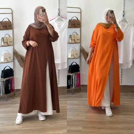 عباية عملية واسعة مع سروال أبيض – إطلالة محتشمة وعصرية