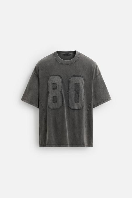 T-SHIRT DÉLAVÉ AVEC PIÈCE