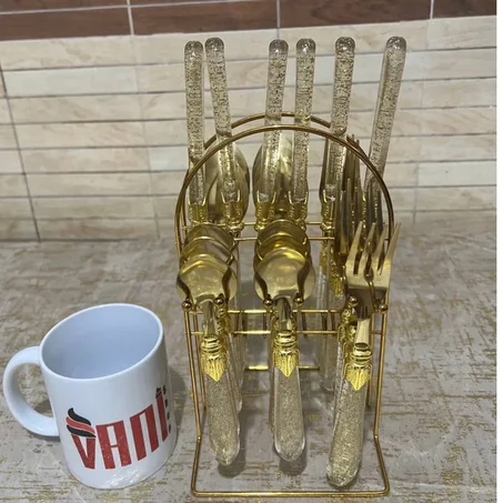 طقم المائدة الذهبي مكون من 24 قطعة + حامل ذهبي 💯