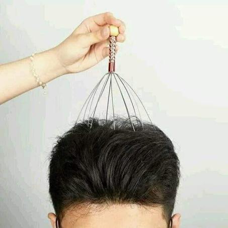 أداة تدليك فروة الرأس
