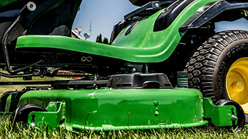 Easy-to-adjust mower wheel and mower side reinforcement
