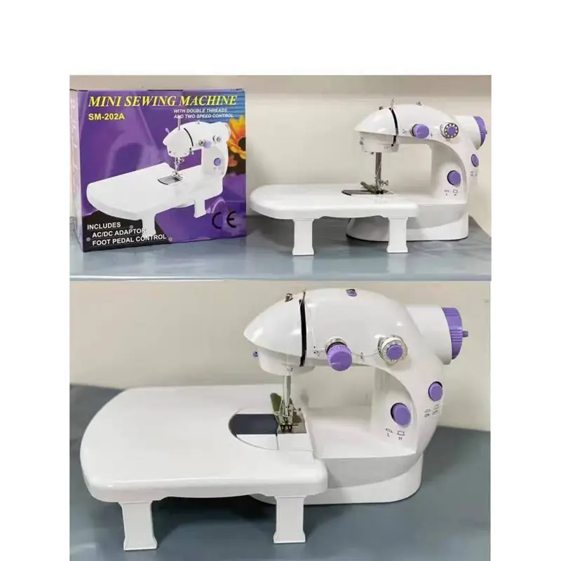الة الخياطة المحمولة مع طاولة