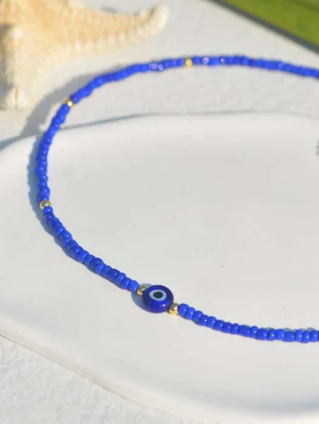 collier bleu roi et oeil pour femme