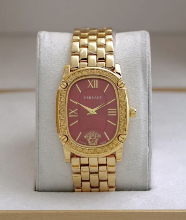 Montre Versace dorée pour femmes, cadran rouge