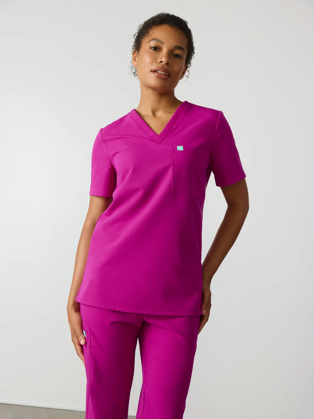 Tenue Stretchy en col V Rose Fushia