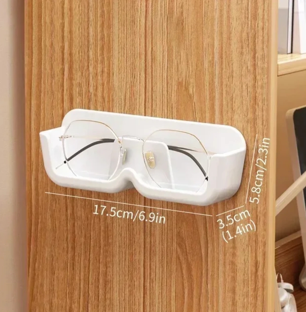 Self-adhesive glasses holder