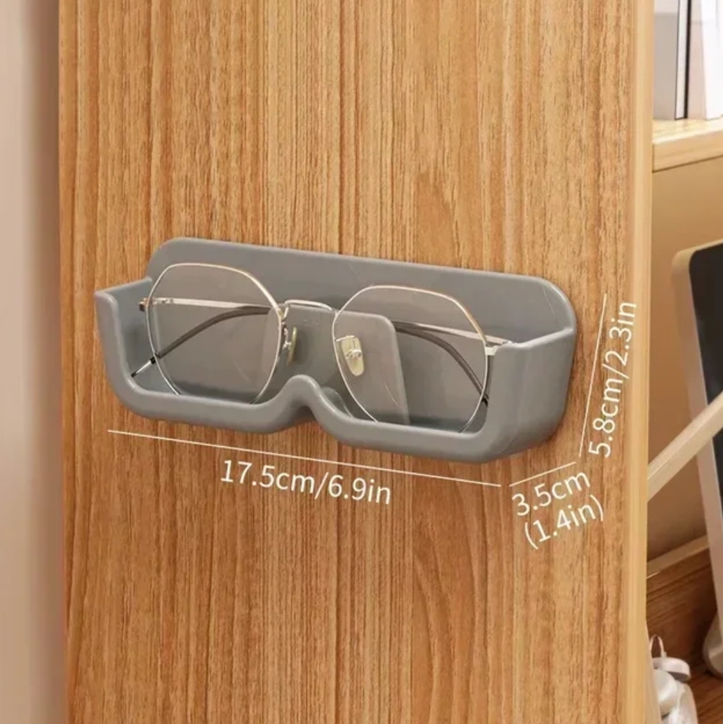 Self-adhesive glasses holder