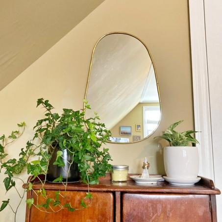 Miroir ovale en laiton doré