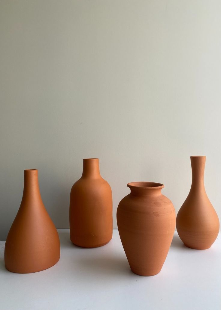 Ensemble de vases décoratifs en poterie – 4 pièces aux formes élégantes et modernes