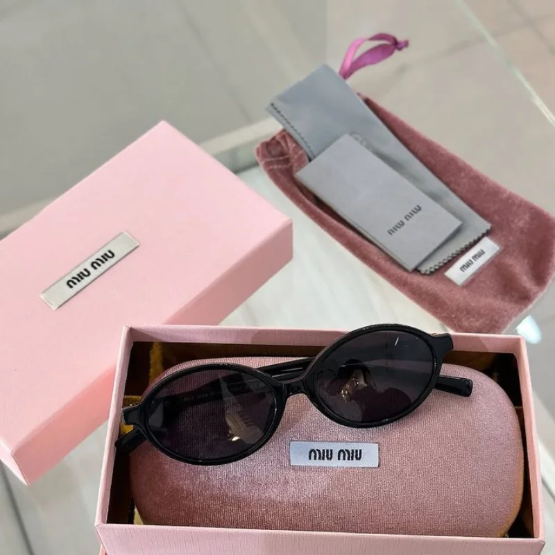 Lunettes de Soleil Miu Miu Rectangulaires Métal