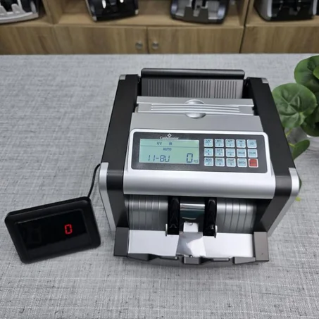 الة عد النقود وكشف الاوراق المزورة محمولة