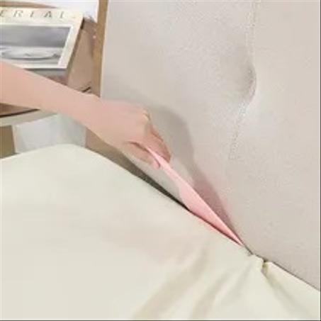 أداة يدوية لترتيب الأفرشة