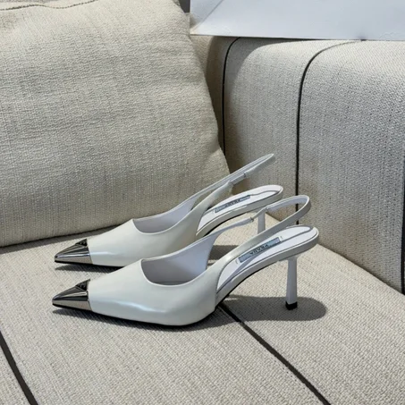 Prada Patent Leather Slingback Pumps with metal in black and white