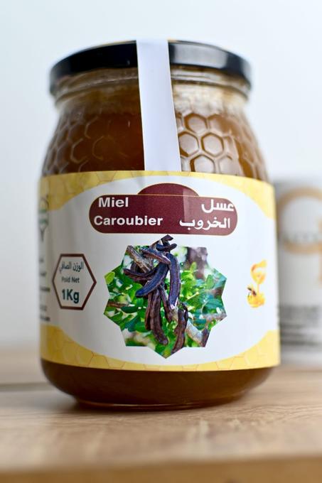 عسل الخروب  الحر