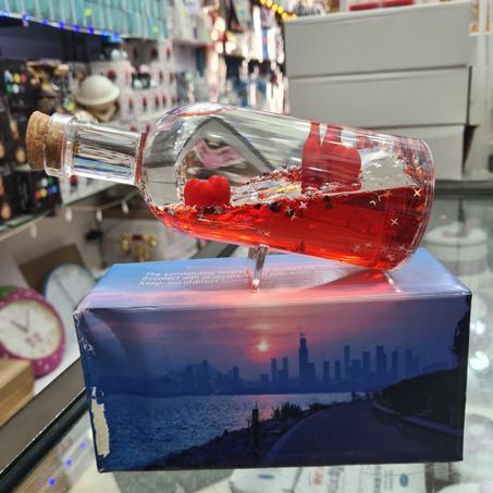 bouteilles a liquide flottant rouge