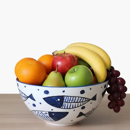 Ciotola da frutta in ceramica con decoro di pesci blu