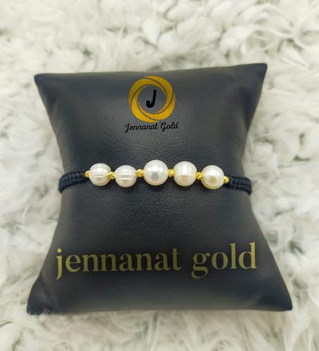 Cordon avec des boules en or et des vrais pierre