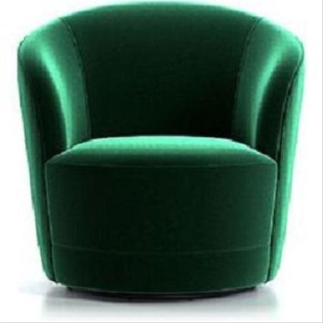 ​كرسي مخملي دوّار باللون الأخضر الزمردي