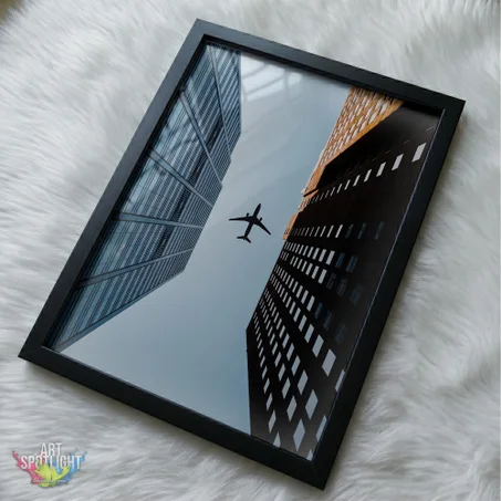 AIRPLANE BETWEEN SKYSCRAPERS