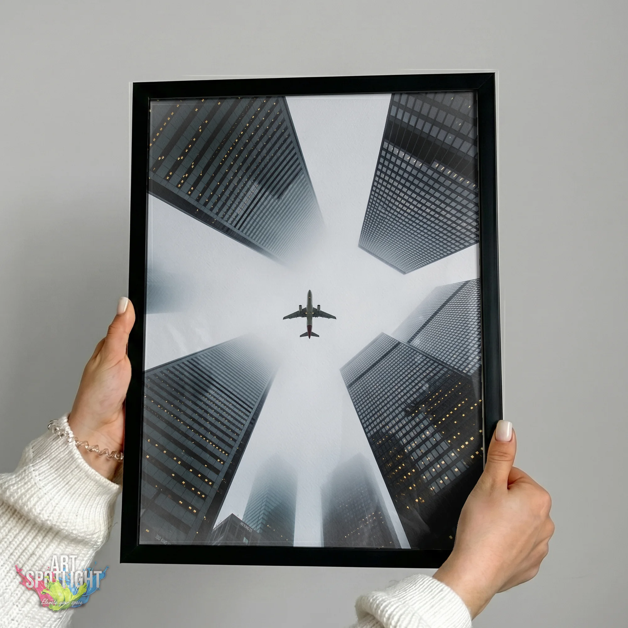 AIRPLANE ABOVE SKYSCRAPERS