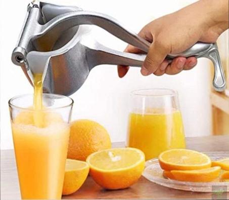 عصارة البرتقال والليمون اليدوية والفواكه