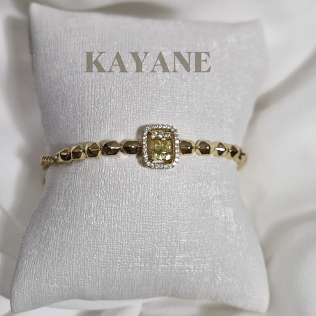 Très jolie gourmette  avec pierre jaune