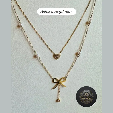 عقد "الأناقة المتفردة" بقلادة الفيونكة واللؤلؤ ✨