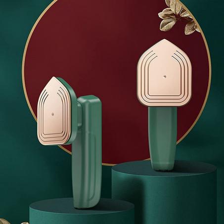 مكواة الملابس البخارية المحمولة باليد