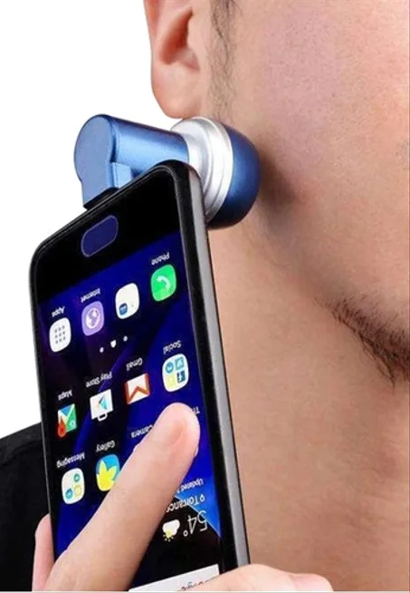 ماكينة حلاقة صغيرة تشبك على الهاتف