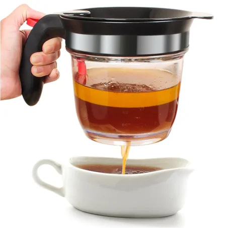 مُصفي وموزع الدهون بفتحة تفريغ سفلية