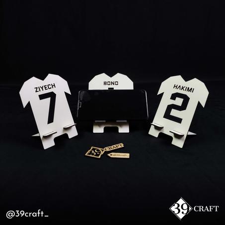 دعامات الهاتف على شكل قمصان المنتخب الوطني بالجملة