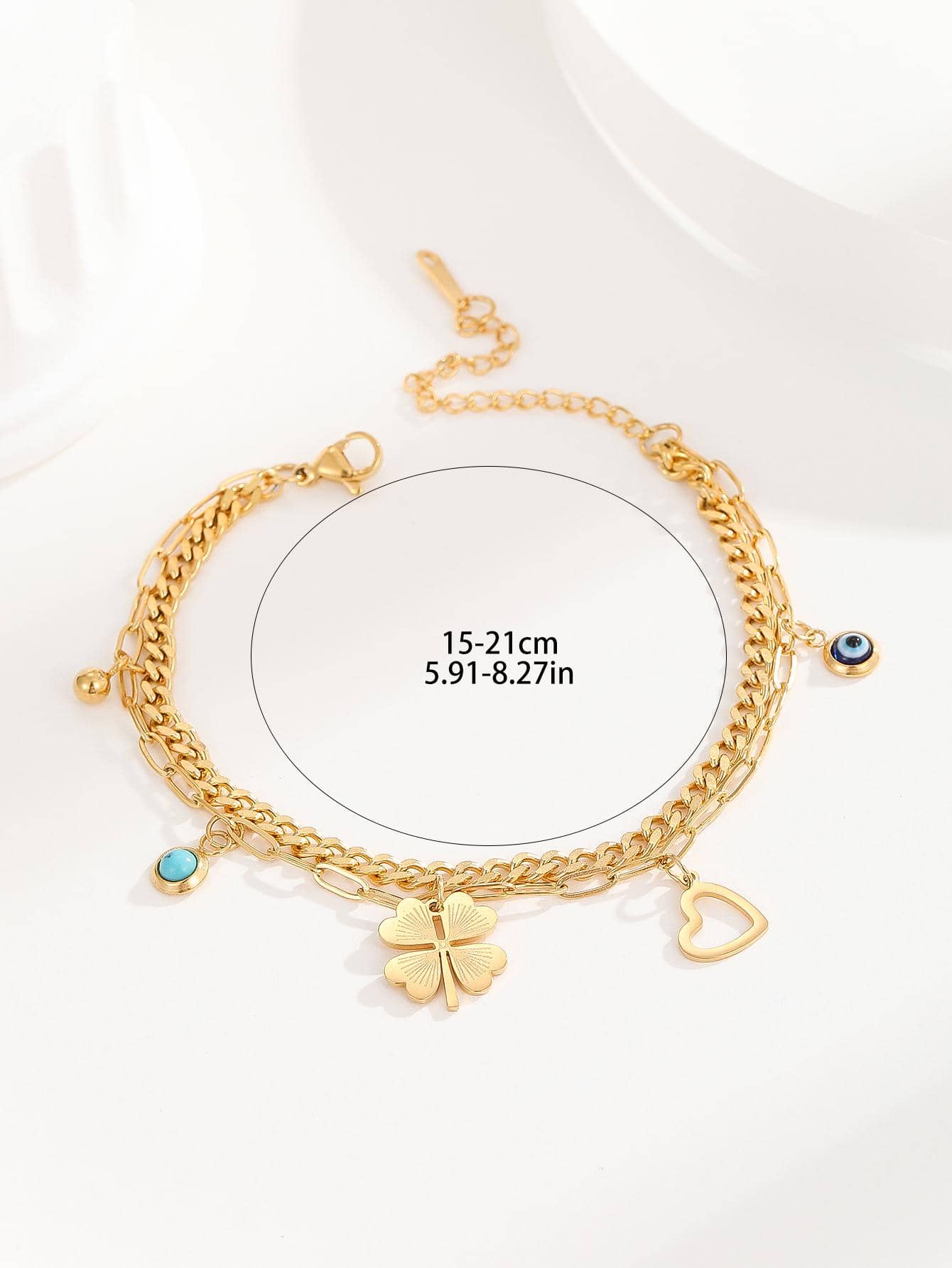 Bracelet à breloque trèfle et mauvais œil