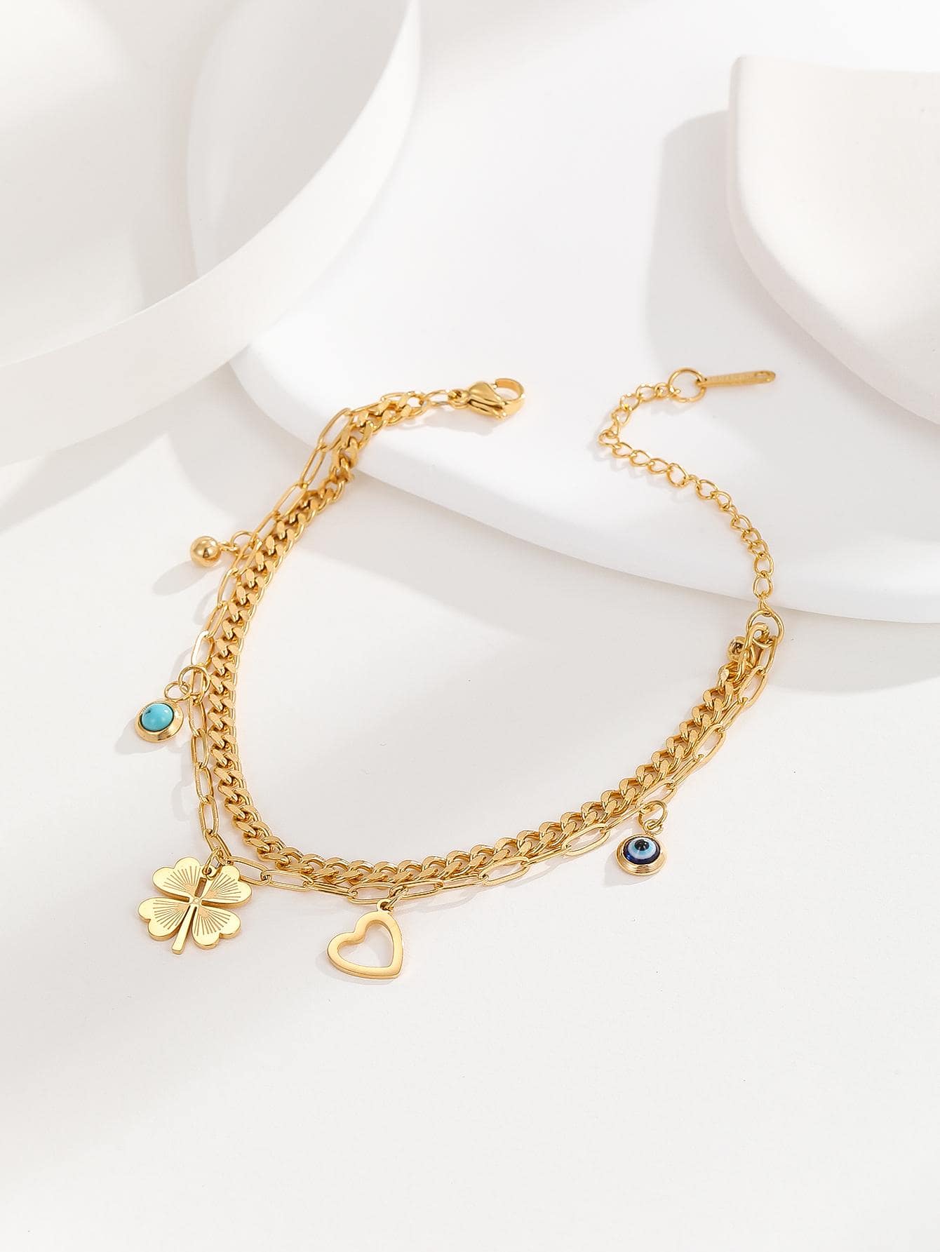 Bracelet à breloque trèfle et mauvais œil