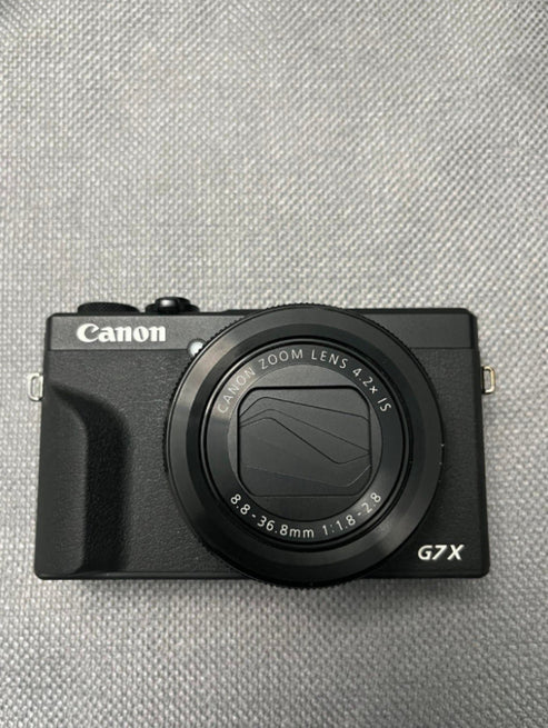 Canon G7x Mark III (barely used).