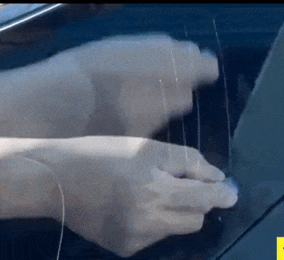 Hands removing scratches from car