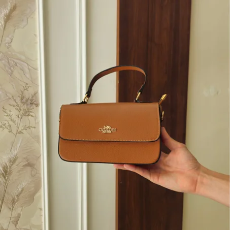Sac à Main Signature Coach – L'Essentiel de l'Élégance