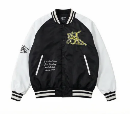 Varsity jacket with contrasting patches and embroidery, side pockets, ribbed trims and snap-button fastening.