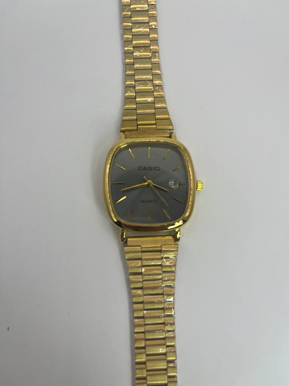 CASIO QUARTZ gold tableau gris